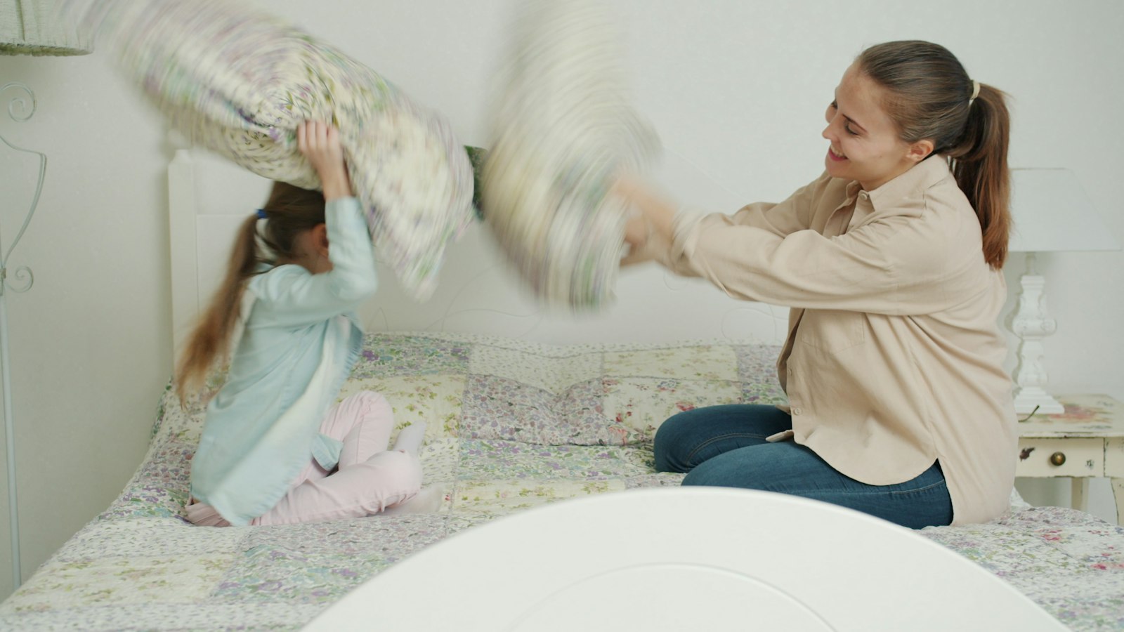 Au pair playing with a child at home